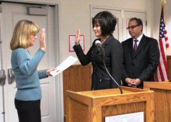 Retiring Turlock City Clerk Rhonda Greenlee swearing in new City Clerk Kellie Weaver. 12-13-11