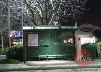 Man Waiting for Bus Robbed of Cell Phones at Gunpoint