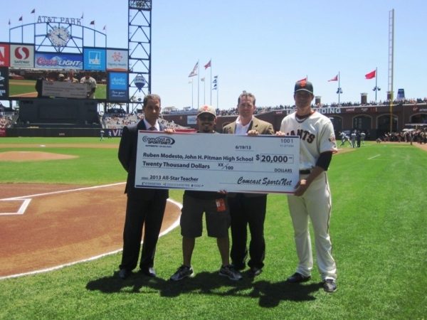 Ruben Modesto accepting the 2013 All-Star Teacher Award and a $20,000 check for Pitman High School where he teaches. 06-19-13