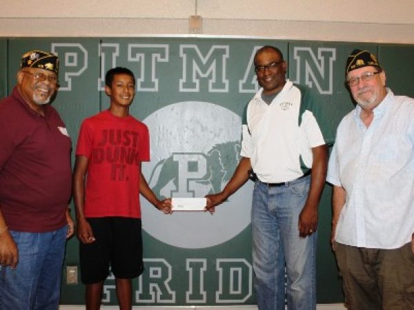 American Legion Members Deliver $350 Donation to Pitman High Boys' Basketball Team. Left to Right: Gunner Bruce, Branson Garcia, Coach Harvey Marable, and John Haggstrom